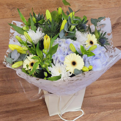 Evelyn - A fabulous collection of white and cream flowers make this the perfect gift. This bouquet will be hand delivered by the local florist.